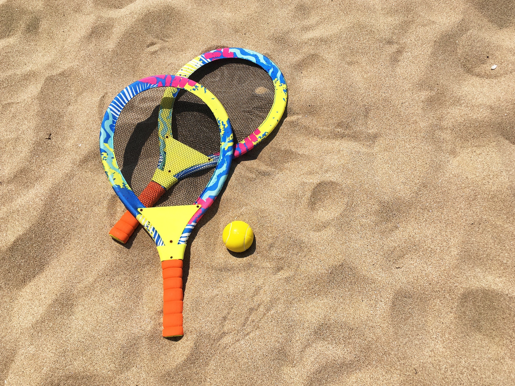 Rackets for playing with a ball on the sand